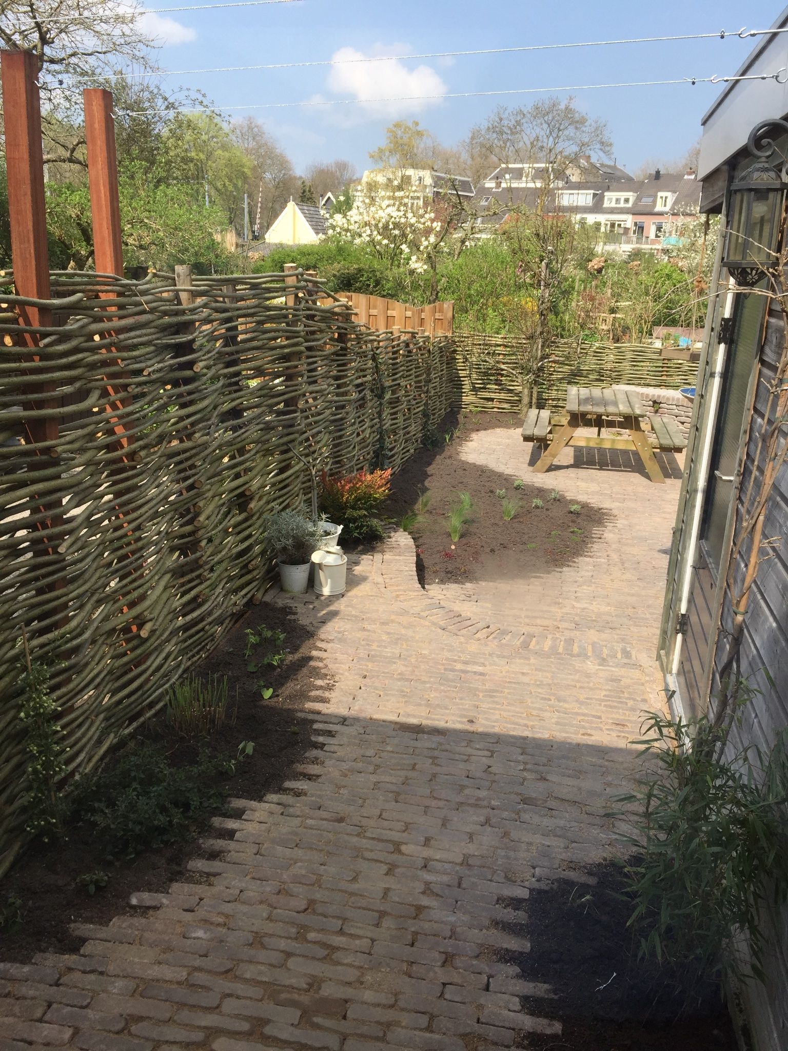 Betegelde tuin 40m2 herinrichten naar groene tuin Werkspot