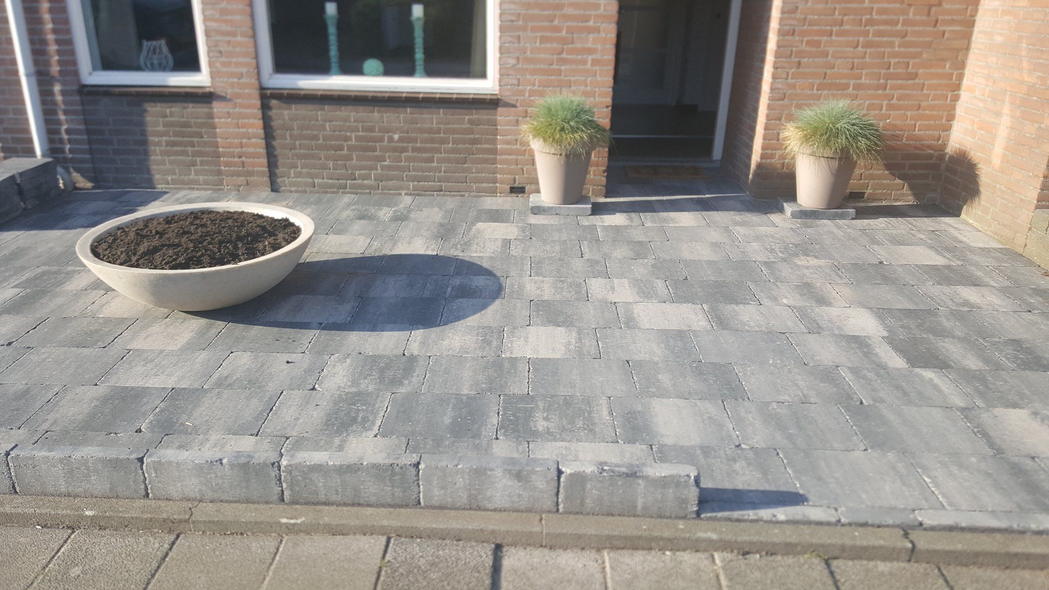 Tuin betegelen Werkspot