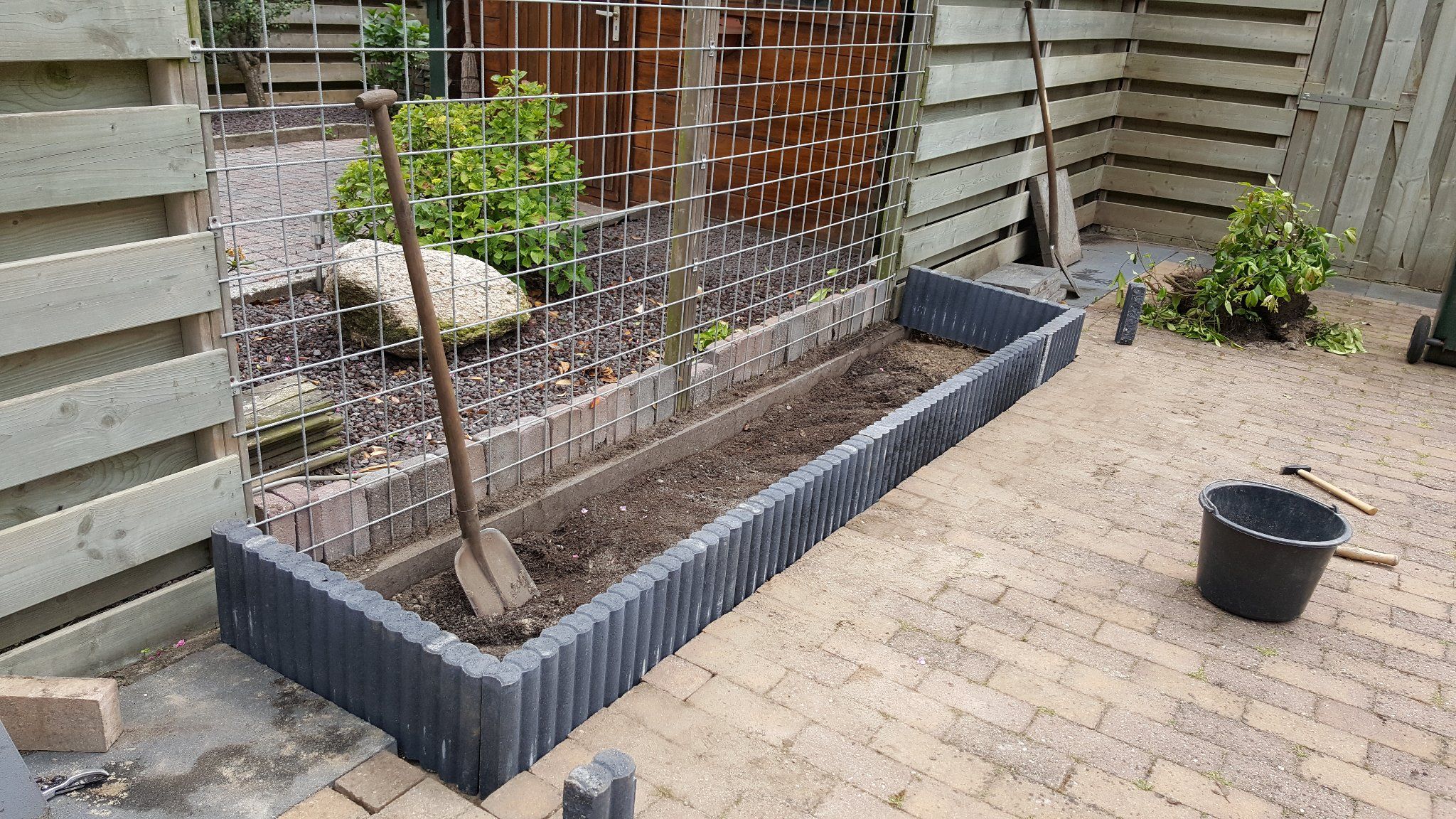 Palissade aanleggen en op maat maken in bestaande tuin Werkspot